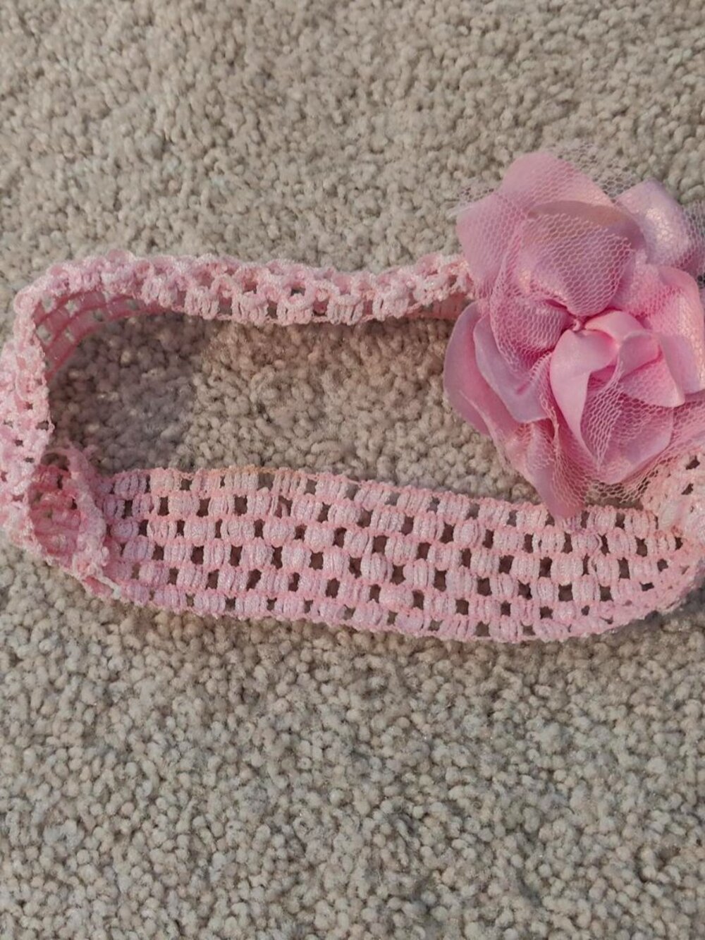 Pink crochet headband with flower detail